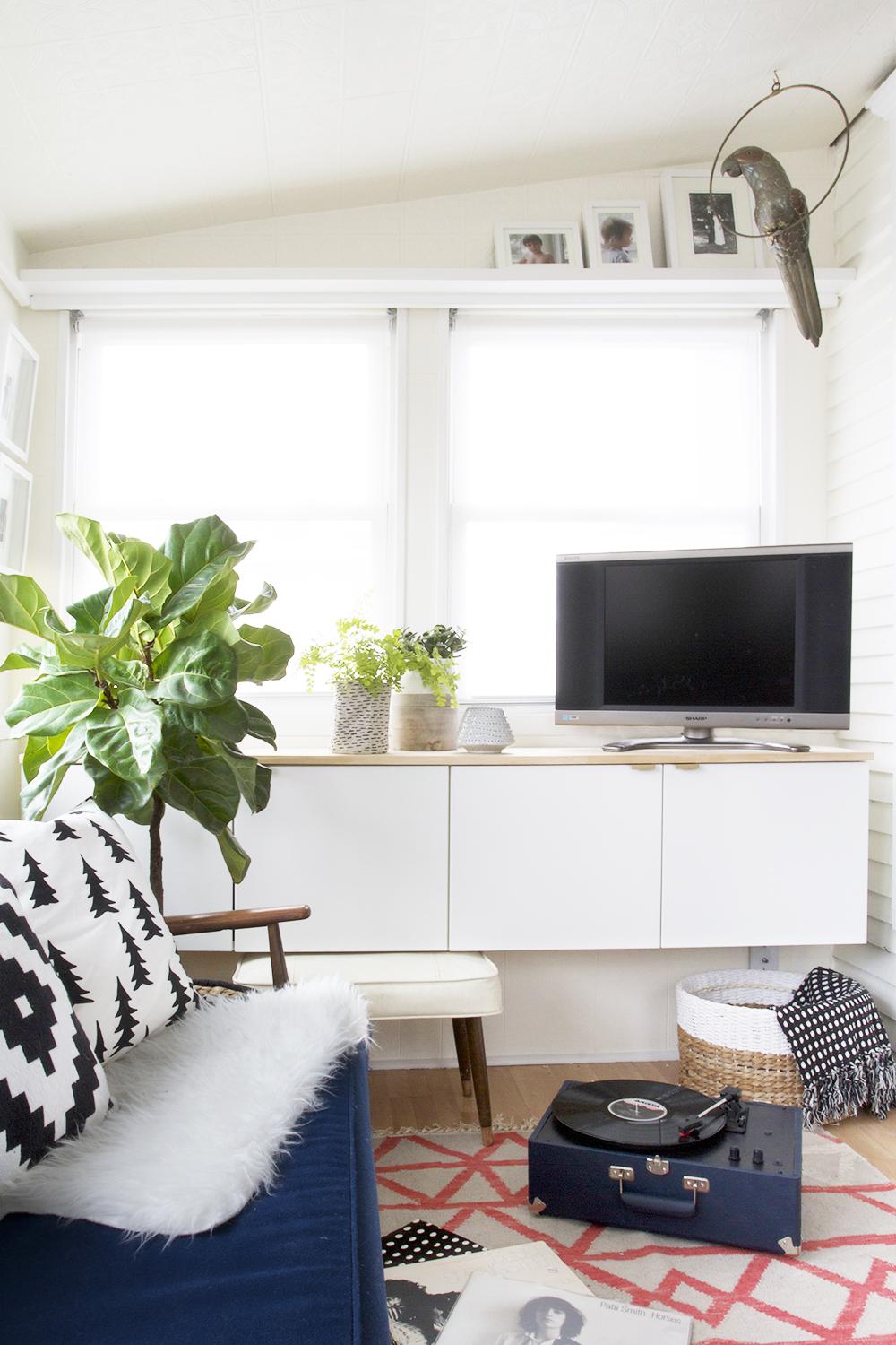 Cozy Four Season Sunroom with Fauxdenza and Navy Sofa