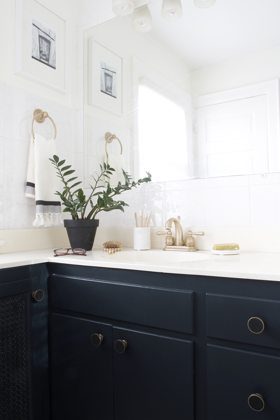 Modern Navy Blue Bathroom with Black, White & Brass Accents