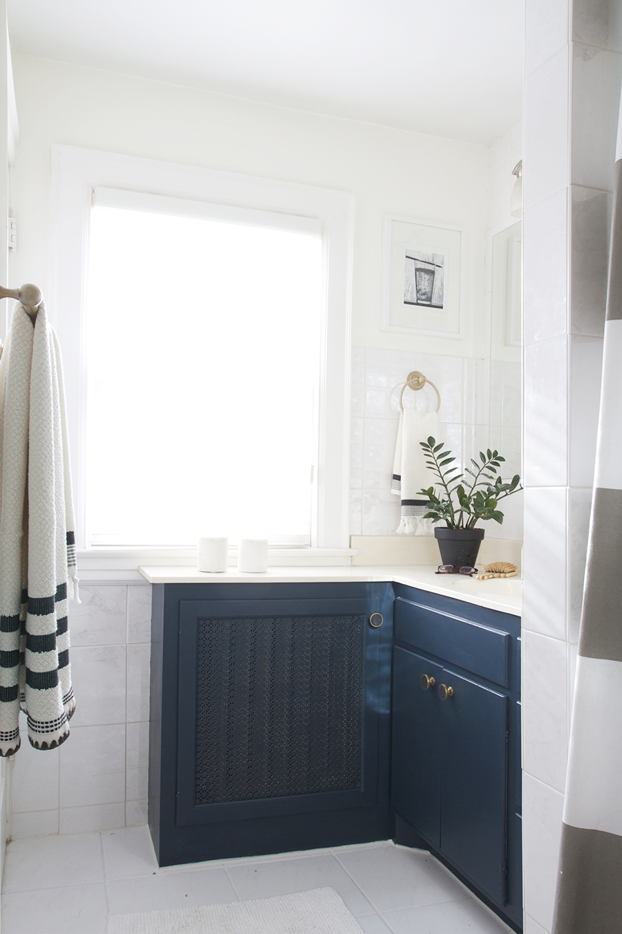 Modern Navy Blue Bathroom with Black, White & Brass Accent