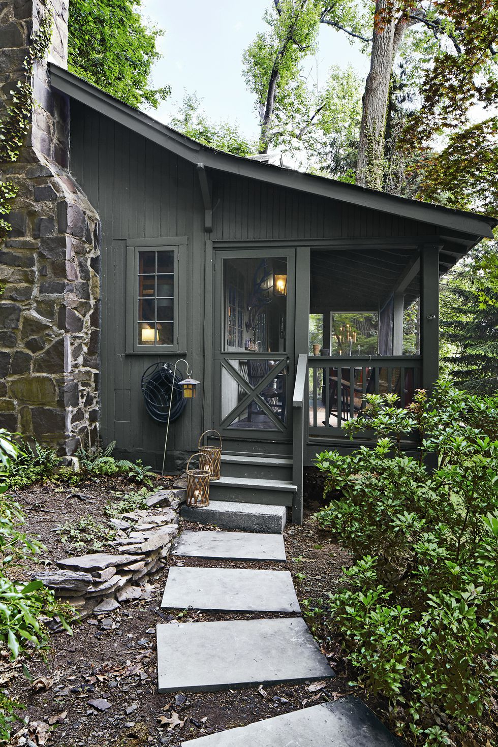 Painting the Cabin Dark Green - Deuce Cities Henhouse Painting the cabin dark green gave it a cozy and inviting feel, blending perfectly with the surrounding nature. The rich hue added a touch of sophistication to the exterior, making the cabin stand out in the woods.