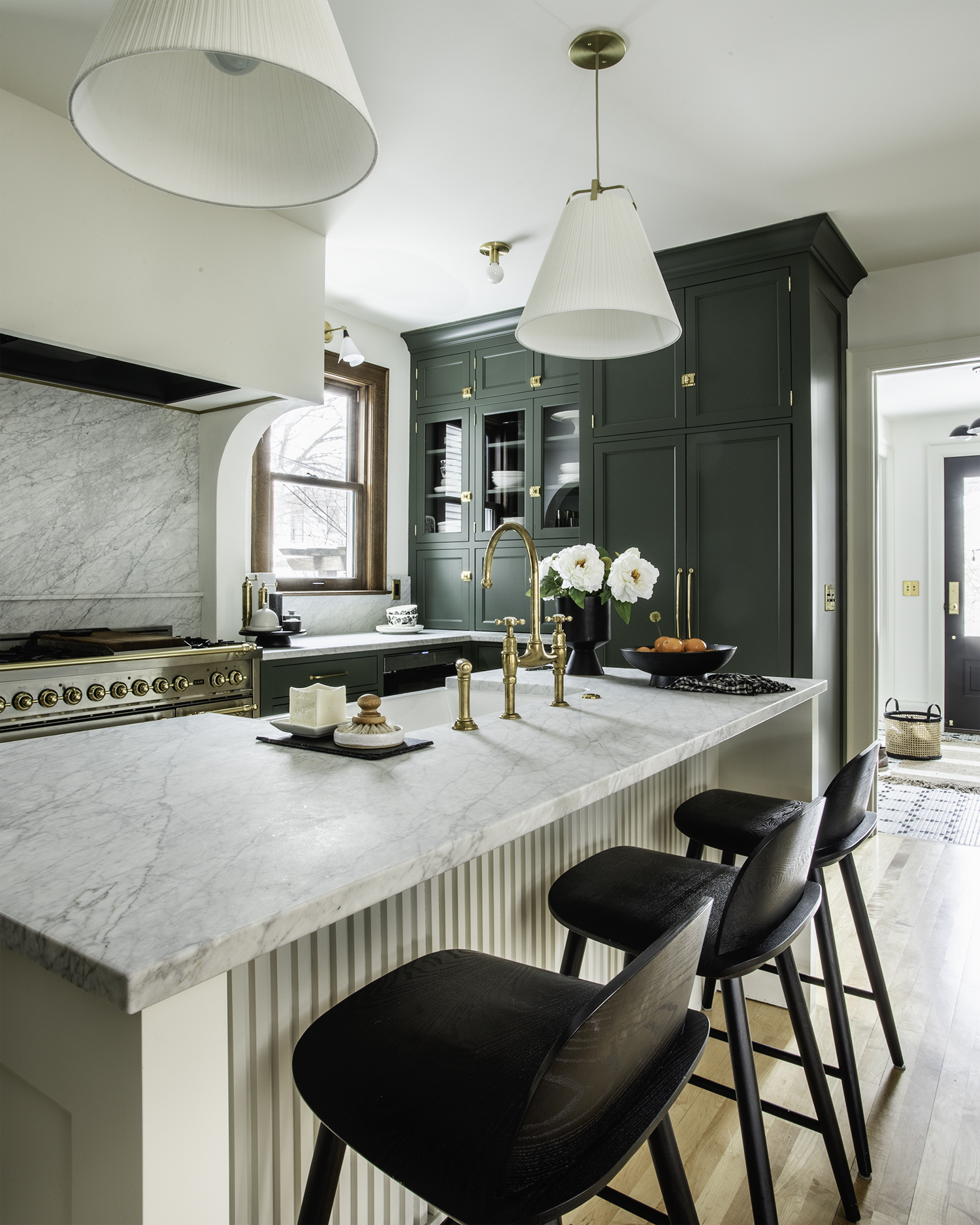 Cream Island with Dark Green Kitchen Cabinetry