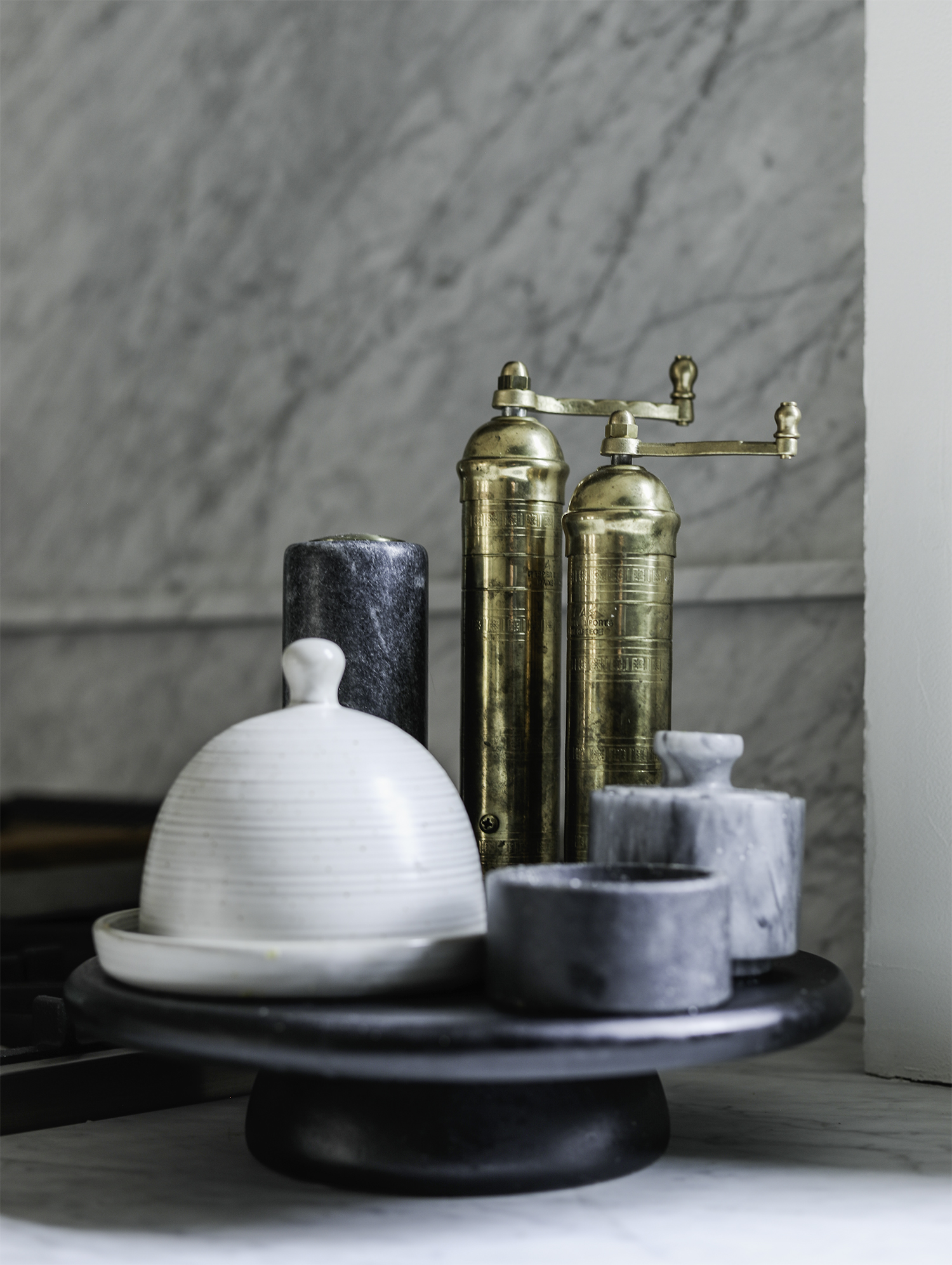 Salt and Pepper Grinders on a Pedestal